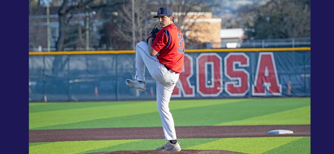 Pitcher, Luke Schat, readies to deliver a pitch.