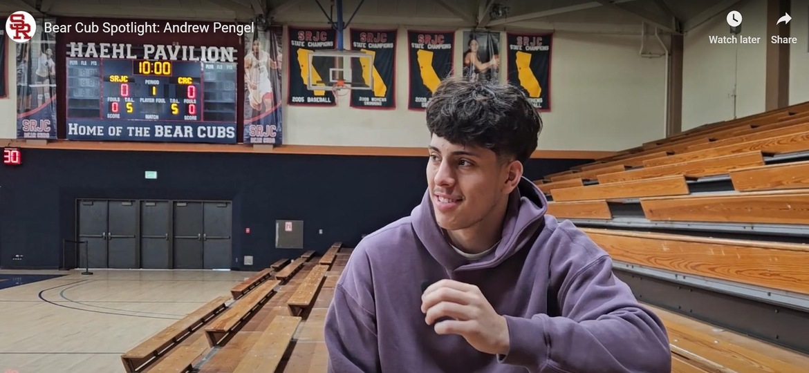 Andrew Pengel giving and interview in the basketball gym