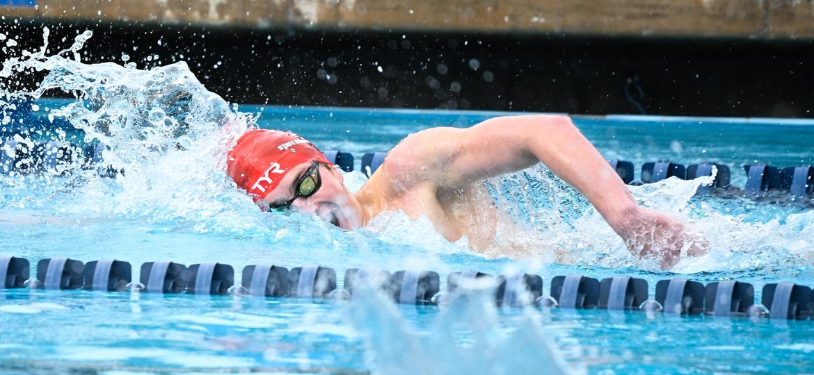 Freshman Kai Holt swims the mile on day three of the state finals.