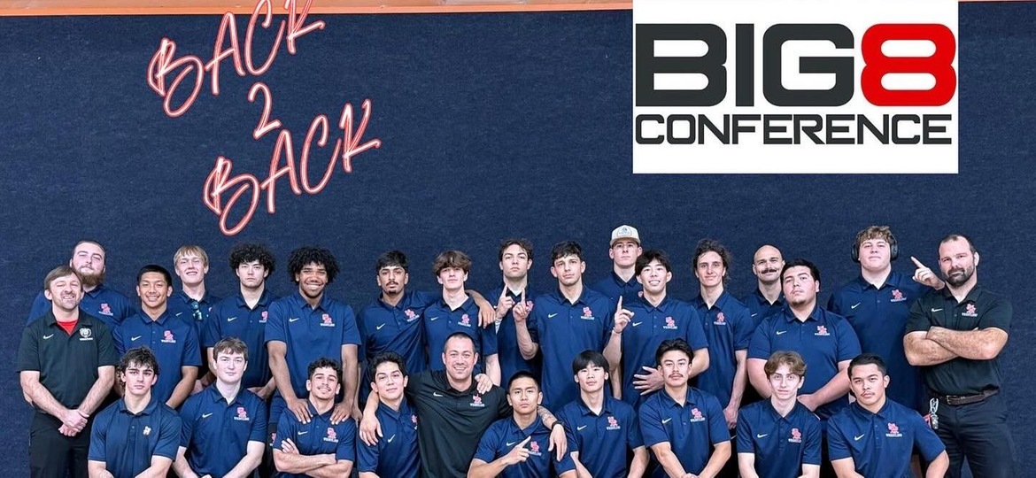 Team celebrates Big 8 Championship.