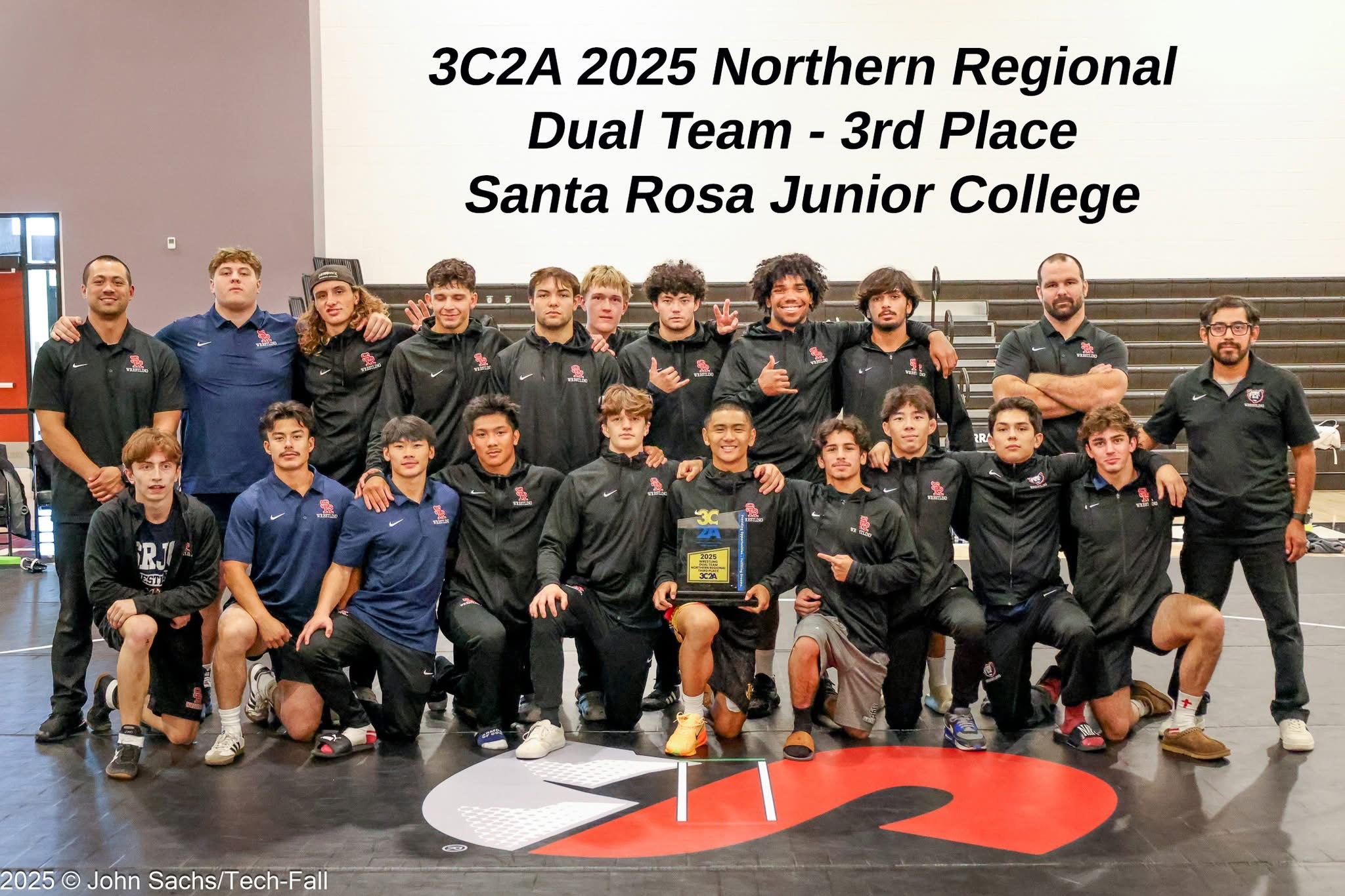 Men's wrestling team poses for a team photo after 3rd place finish.